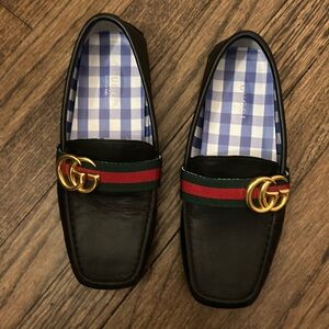 Black loafers with classic stripe. Worn a handful of times. Like new.”